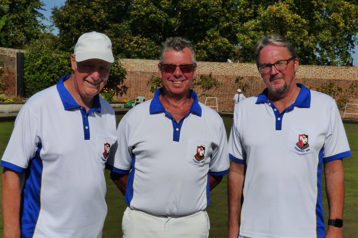 Championship Singles Finalists flanking marker Dave White.